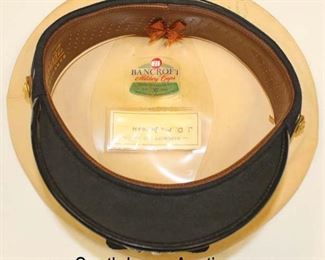 Lot 149: Lot of Personal Effects of Veteran of WWII, Korea, and Vietnam John D. McIntosh including WWII USN Officers Visor Cap, Photo of John D. McIntosh, 2 Military Photos, Front Band, and 2 Extra Hat Covers in the Original Shipping Box