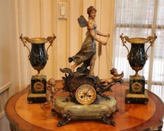 S. Marti cold painted figural clock and pair of marble urns