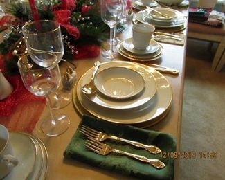 We set the table with Mikasa china, community gold plated flatware and beautiful gold-rimmed glassware.