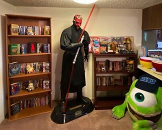 Life size star wats Darth figure. Mike stuffed figure from monsters inc. vintage star wats figures and toys. Marvel comics accessories. Fantasy books.