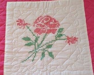 Close up of rose cross stitch motif