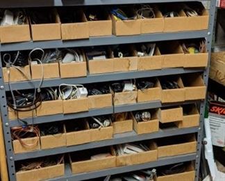 lots of hardware in steel shelving unit