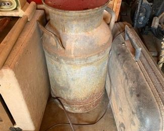 #78		metal milk can w red metal top 	 $20.00 

