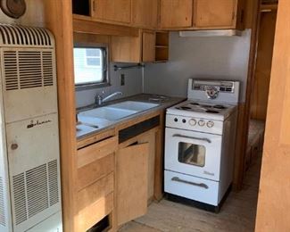 #101	outside	1954 Spartan as is travel trailer with 1 bedroom, bath, kitchen, ac and heat	 $6,500.00 
