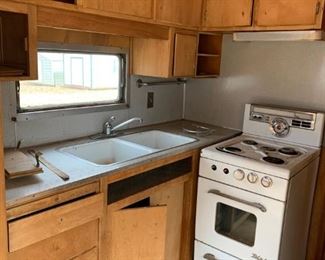 #101	outside	1954 Spartan as is travel trailer with 1 bedroom, bath, kitchen, ac and heat	 $6,500.00 
