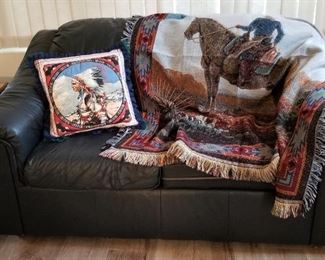 Flexsteel charcoal leather loveseat along with cowboy throw and beautiful art pillow.