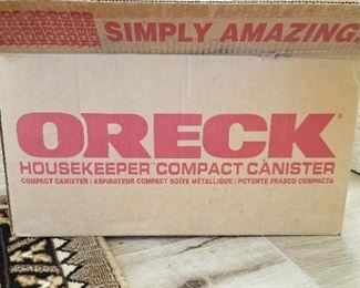 New Oreck canister vacuum in box never used. This retails for over $600.