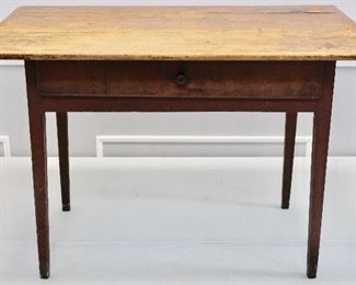 early tavern table with red paint.