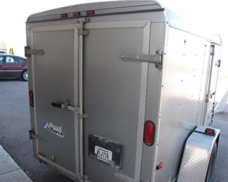 Wells Cargo 5'x8' trailer less than 3500 miles on bearings and tires. Side Door, Barn Rear Door both can be locked.