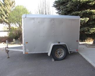 Wells Cargo 5'x8' trailer less than 3500 miles on bearings and tires. Side Door, Barn Rear Door both can be locked.