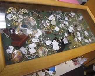 Jewelry (rings, bracelets, Necklaces, Broaches, Pins w/precious jewels, Cuff Links and Jewelry Display Case with display top and Drawers