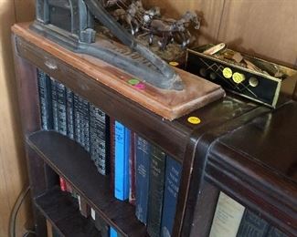 Two matching bookcases full of old books and novels 