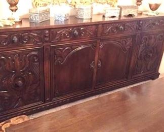 Stunning carved wood side board in dining room