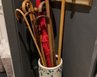 A French umbrella stand filled with canes