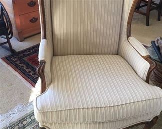 One of pair of matching wing chairs
