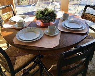 Antique oak pedestal base dining table w/1 leaf -surrounded by set of Hitchcock chairs