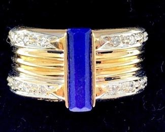 14k two tone gold Circle Fine Art (CFA) after Erte band. Set with rectangular cut lapis lazuli measuring 11.5 x 3.5 mm accented with round brilliant cut diamonds. Total estimated diamond weight 0.14 ct., Sl1 clarity, I color. Signed and numbered 19/125 on inside. Overall weight 9.9 gm. Ring Size: 8-8.5 Condition: Very good with minor spots.