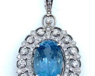 Polished, stamped and tested, 14K white gold pendant mounted with 1 genuine aquamarine center stone weighing approximately 5.17 carat, and 67 genuine round diamonds weighting approximately 1.10 carats.  Pendant hangs from a 14K Gold link chain measuring 18 inches in length.Natural Beryl Aquamarine Oval Shape, Modified Brilliant Cut 13.7 x 9.1 x 7.5mm, approx 5.17 carat, Light Blue 67 Natural Round Brilliant Cut Diamonds 1.1 - 2.2 mm Diamond weight. approx 1.10 carats Clarity S12-12. Color Grade G-I Aquamarine Weight. 5.17 ct. Diamond Weight approx 1.10 cts. Total Weight. 12.3 grams Gold Content: 14K White Gold  Length including Pendant: 10.5 in. Condition: New, excellent workmanship AIGL Appraisal included
