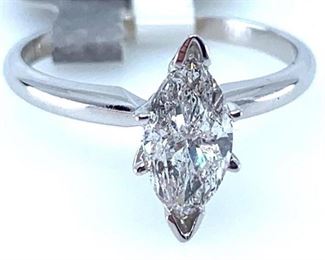 14KT white gold ladies cast and assembled diamond solitaire ring with a bright finish. Identified with markings of "14K". One prong set marquise shaped cut diamond, measuring approx 9.80 x 5.09 x 3.75mm. Approximate weight 1.23ct. Clarity I-1, Color G Symmetry, good. Total Weight of Diamonds approx 1.23ct. Total Weight of Ring approx 2.50gm  Ring Size: approx 5.75 Condition: New, good workmanship AIG Appraisal Included
