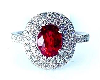 Platinum ladies cast ruby and diamond ring featuring a ruby set within a tiered diamond bezel, supported by an elaborate lattice under gallery and diamond ribbon shoulders, completed by a two millimeter wide band. Bright polish finish. Trademark is Orianne. Markings "PT950".  One prong set oval mixed cut natural ruby, measuring 8.12 x 5.87 x 3.87mm. Exact weight 1.64ct. Clarity is slightly included, type II, medium dark, moderately strong red color (GIA R 6/4). Cut is good.  56 prong set round brilliant cut diamonds exact total weight 56 Stones = 0.52ct. Clarity SI1-SI2. Color F-II Total Weight of Stone 1.64ct. Total Weight of Diamonds 0.52ct. Total Weight of Ring  7.30gm Ring Size: 6.5  Condition: New, good workmanship  AIG Appraisal and GIA Report Included
