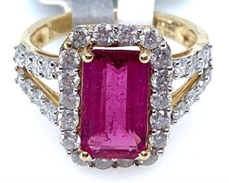 14KT yellow gold ladies cast and assembled tourmaline and diamond ring featuring a pink tourmaline set within a diamond bezel, supported by diamond set split shoulders, completed by a three millimeter wide band. Bright polish finish with rhodium accents. Marked "14K" Trademark A. ISAACS.  1 prong set rectangular set cut natural pink tourmaline measuring 11.10 x 6.20 x 3.60mm, approximate weight of 2.23ct. Clarity is moderately included, type II, medium, strong, purple red color (GIA PR 5/5). Cut is good. 34 prong set round brilliant cut diamonds approximate total weight of 34 Stones = 1.32ct. Clarity SI-3 to I-1. Color G-I Total Weight of Stones 2.23ct. Total Weight of Diamonds 1.32ct. Total Weight of Ring 3.90gm  Ring Size: 6 Condition: New, good workmanship AIG Appraisal Included
