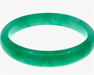 Chinese Hardstone Bangle Bracelet. Plain bangle in mottled apple green. 2.5 in. interior dia. 54g.
