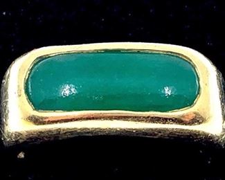 Gentleman's 18K Yellow Gold and Jade Ring. Simple form set with oblong bright green jade stone, stamped 18K. Ring size 9.5. Approx 31gm.