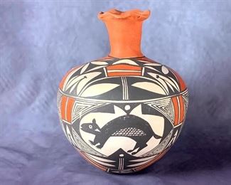 Acoma Pottery Jar, Signed V.S. Acoma Pottery Jar, Signed V.S. Sperical form with cylindrical neck and ruffled rim, decorated in polychrome slip glaze with animal figures and geometric motifs. Signed V.S. Acoma N.M.  9.75 in. h. x 8.5 in.w.  Condition: Glue repair to chip at rim, some minor wear to surface.