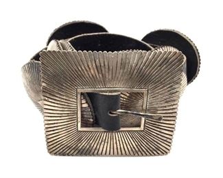 Sterling Silver and Leather Concho Belt,Orville White, Sterling Silver and Leather Concho Belt, Orville White, with squared fluted buckle and 10 oval fluted leather backed concho plates. Buckle signed O.W.  Belt buckle is 3.5 x 3.25 in. Each concho plate is 3 x 2.75 in.  Full length of leather belt is 51 in.  Condition: Good tarnished condition