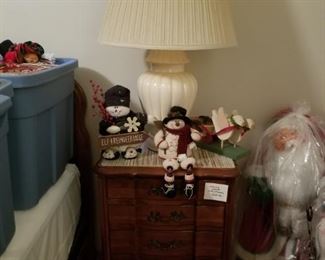 Christmas ornaments on cherrywood bed