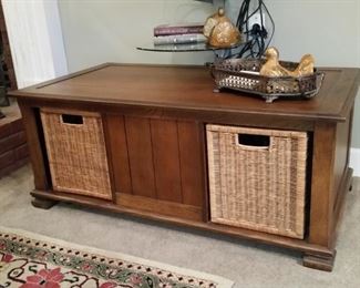 A closer look at the table with storage baskets