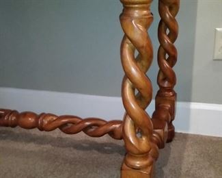 A close look at the table's carved double spiral legs
