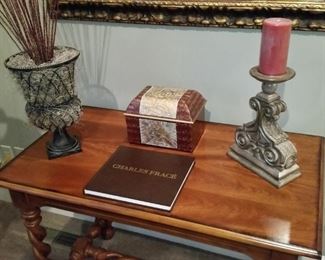 One of the items on top of this table is a collector's edition book on the art of Charles Fracé.