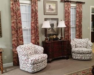 Next to the three drawer chest is a pair of very comfortable c.