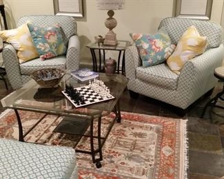 Two matching blue Moroccan tile pattern chairs with one ottoman.  Two wrought iron glass top tables.  Wool rug is 4 ft. x 6 ft. 