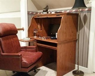 Leather executive chair and oak roll top desk