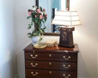 This cherry four-drawer chest with pull out is made by Councill