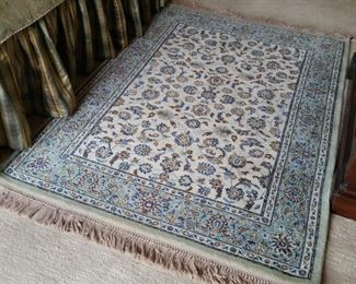 This primarily blue Karastan rug measures 4.3 ft. by 6 ft.