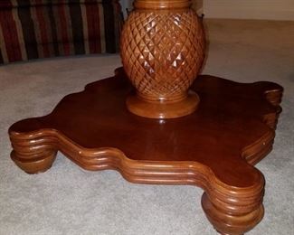 The pineapple pedestal of the cherry coffee table