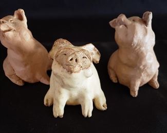 Three pigs, in clay