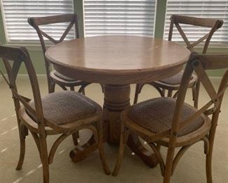 4 chairs and an oak table.  Chairs are locally made.  Desk is oak, does not match chairs.  