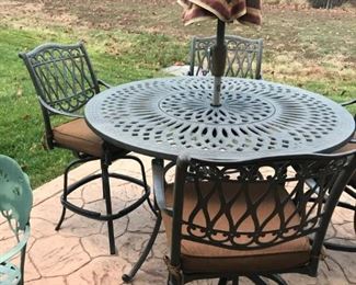 Outdoor table and 4 high swivel chairs.  