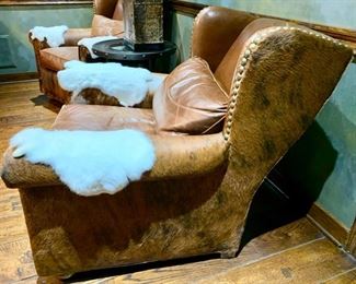 109. Pair of Cowhide and Leather Wingback Club Chair w/ Nailhead Detail (38" x 41" x 36")