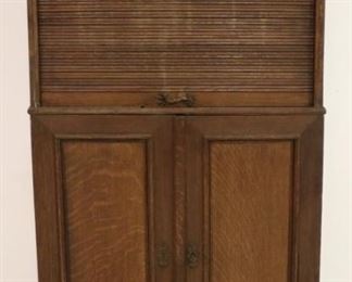 Very unusual vintage roll front cabinet in oak