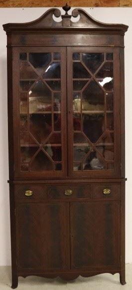 Eagle adorned mahogany corner cabinet