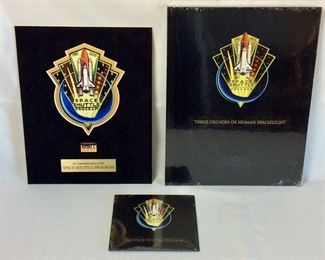 United Space Alliance Commemorative Package for the successful completion of the NASA Space Shuttle Program. Package includes Commemorative Book that examines the accomplishments of the Space Shuttle Program, Commemorative Video, and a matted "End of Space Shuttle Program" suitable for framing. Enclosed in an embossed slip case.