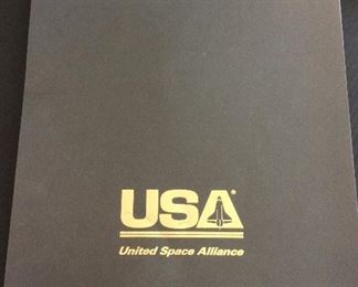 United Space Alliance Commemorative Package for the successful completion of the NASA Space Shuttle Program. Package includes Commemorative Book that examines the accomplishments of the Space Shuttle Program, Commemorative Video, and a matted "End of Space Shuttle Program" suitable for framing. Enclosed in an embossed slip case.