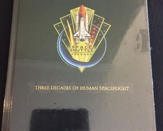 United Space Alliance Commemorative Package for the successful completion of the NASA Space Shuttle Program. Package includes Commemorative Book that examines the accomplishments of the Space Shuttle Program, Commemorative Video, and a matted "End of Space Shuttle Program" suitable for framing. Enclosed in an embossed slip case. Book still in original shrink-wrap.