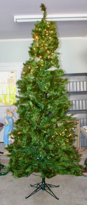 Large partially lighted Christmas tree - one of two.