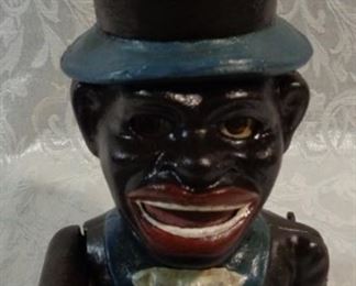 Jolly boy with hat bank cast iron